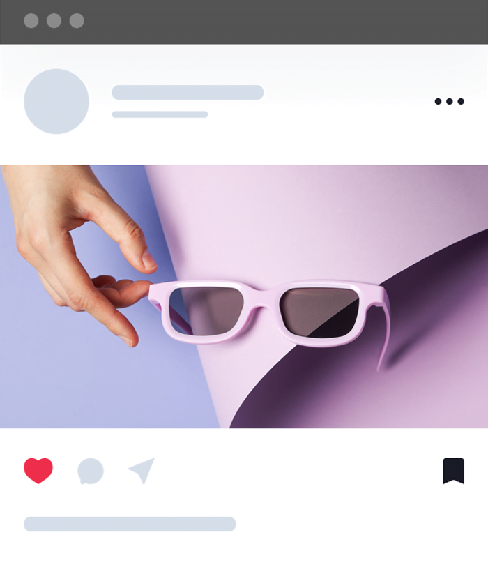 sunglasses in hand on purple background close up NQBKRR9
